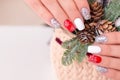 Female hand with creative manicure nails, winter design