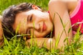 Close up view of beautiful girl on green grass Royalty Free Stock Photo