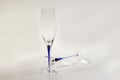 Close up view of a beautiful two slim, tall and elegant champagne glasses isolated on background.