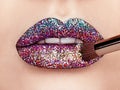 Close up view of beautiful woman lips with colorful lipstick