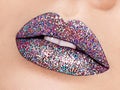 Close up view of beautiful woman lips with colorful lipstick