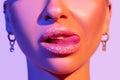 Close up view of beautiful woman lips in colourful bright light Royalty Free Stock Photo