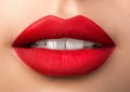 Close up view of beautiful woman lips with red matt lipstick Royalty Free Stock Photo