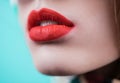 Close up view of beautiful woman lips with red matte lipstick. Open mouth. Cosmetology, fashion makeup concept. Beauty studio shot Royalty Free Stock Photo