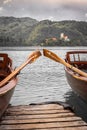 Close up view on beautiful wooden flat rowing boats with oars on lake bled, slovenia, go green concept