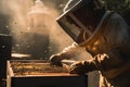 A close-up view of a beekeeper carefully tending to a buzzing beehive, wearing protective gear, and using a smoker to calm the