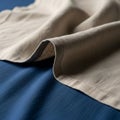 A close-up view of beige fabric draped over a royal blue textile Royalty Free Stock Photo