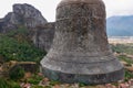 Meteora - Stone bell on top of rock Aghio Pnevma (Holy Spirit). Panoramic view on valley between village of Kastraki Royalty Free Stock Photo