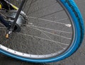 Close up view at a bicycle wheel with metal spokes Royalty Free Stock Photo