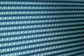 Close-up view of binary code displayed on a digital screen, representing data processing and technology in modern comput Royalty Free Stock Photo