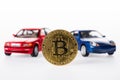close-up view of bitcoin and car models Royalty Free Stock Photo
