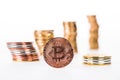 close-up view of bitcoin and stacked coins Royalty Free Stock Photo