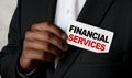 Close up view of a black man holding a business card. A young African businessman takes out a business card from the pocket of his Royalty Free Stock Photo