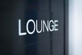 Black sign to lounge room in airport. Royalty Free Stock Photo