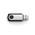 Close up view of a black and silver usb drive laying on a white surface in a studio setting Royalty Free Stock Photo