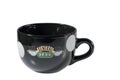 Close up view of black souvenir cup with Central Perk logo from famous Friends serial.