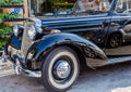 Close Up View of a Black Vintage Antique Mercedes Benz Car Front. Rare Elegant Collectible Vehicle on the Roads of Chania, Greece Royalty Free Stock Photo