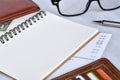 Close-up view, Blank notebook for daily expenses with wallet, bill, pencil and glasses is elements. Royalty Free Stock Photo