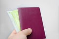 Close up view of a blank  passport cover  and     face  mask  on a white background . Documents and  requirements  to travel to Royalty Free Stock Photo