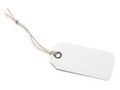 A close-up view of a blank white tag attached to a piece of string isolated on white background Royalty Free Stock Photo