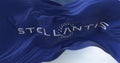 Close-up view of the blue flag with the Stellantis logo waving in the wind