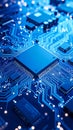 Close-up view of a blue illuminated computer circuit board and processor Royalty Free Stock Photo
