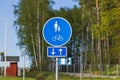 Close up view of blue road sign for pedestrians and bicycles lane. Royalty Free Stock Photo