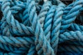 Close up view of blue ropes and nylon nets used to fish.