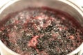 Close-up view of boiling blueberries. Cooking blueberry jam. Royalty Free Stock Photo