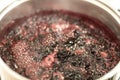 Close-up view of boiling blueberries. Cooking blueberry jam. Royalty Free Stock Photo