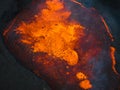 Close up view of boiling lava lake inside volcano crater, drone top down shot