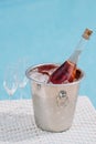 close-up view of bottle of champagne in bucket with ice and two empty glasses Royalty Free Stock Photo