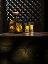 Anejo and glasses on color background