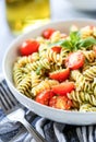 Fresh Pesto Pasta Salad With Cherry Tomatoes and Basil in Natural Daylight Royalty Free Stock Photo