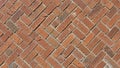 A close up view of a brick pavement arranged in a herringbone pattern Royalty Free Stock Photo