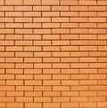 Orange-brown bricks arranged in a classic running bond pattern Royalty Free Stock Photo