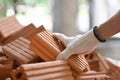 Close up view of bricklayer working on construction site. Concept of repair and building materials