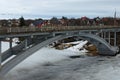 Close-up view of the bridge over Ros River in Bila Tserkva. Winter landscape view of frozen river in cloudy day Royalty Free Stock Photo