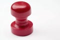 A close-up view of a bright red rubber stamp on a white surface Royalty Free Stock Photo