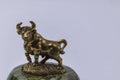Close up view of bronze figure of Taurus cattle sign isolated on background