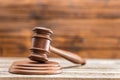 Close-up view of brown wooden mallet of judge on wooden table