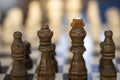 close up view of brown wooden pawns of chess
