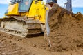 Crawler`s tracks, bulldozer machine is leveling construction site Royalty Free Stock Photo