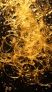 a close up view of a bunch of gold liquid on a black surface