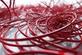 A close-up view of a bunch of red wires. This image can be used to illustrate electrical connections or technology