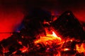 Close up view of burning coal from burning wood in fireplace. Royalty Free Stock Photo