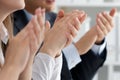 Close up view of business seminar listeners clapping hands Royalty Free Stock Photo