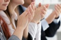 Close up view of business seminar listeners clapping hands Royalty Free Stock Photo