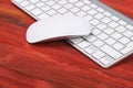 Close up view of a business workplace with wireless computer keyboard, keys on old dark burned wooden table background. Office Royalty Free Stock Photo