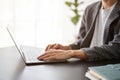 Close up view of businessman typing on laptop while working in the office room Royalty Free Stock Photo